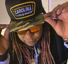 Load image into Gallery viewer, Gorra Camuflaje Carolina La Cuna Del Reggaeton
